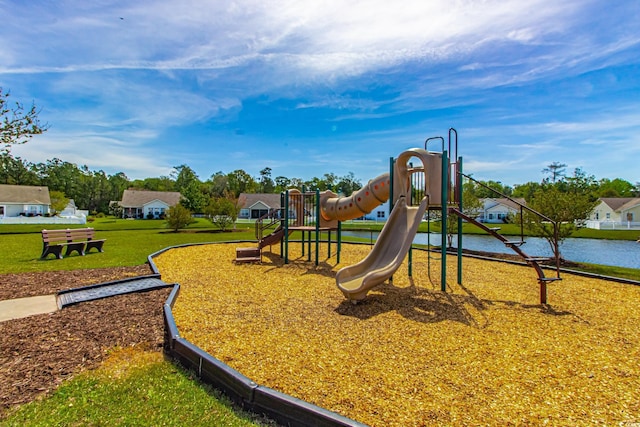 view of jungle gym with a water view and a yard