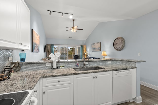 kitchen with white cabinetry, dishwasher, sink, light stone counters, and kitchen peninsula