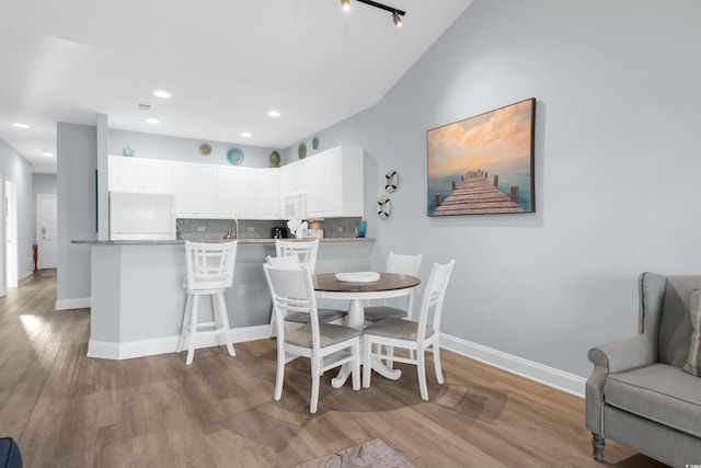 dining room with light hardwood / wood-style floors