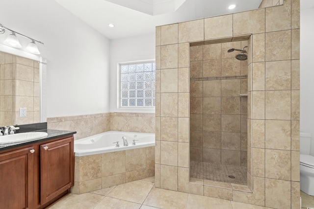 full bathroom featuring vanity, toilet, independent shower and bath, and tile patterned flooring