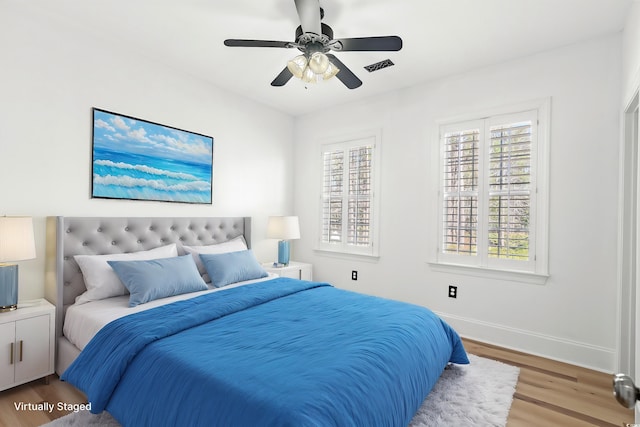 bedroom featuring hardwood / wood-style floors and ceiling fan