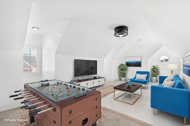 playroom featuring lofted ceiling