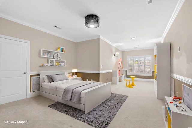 bedroom with ornamental molding and light carpet