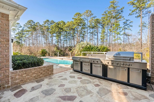 view of patio / terrace featuring an outdoor kitchen and grilling area