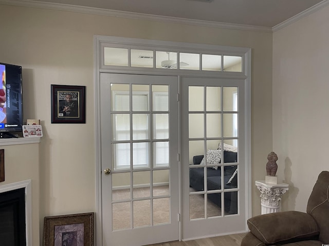 9764 Leyland Dr Unit 7, Myrtle Beach, SC 29572 - doorway with crown molding, wood finished floors, a fireplace, and healthy amount of natural light