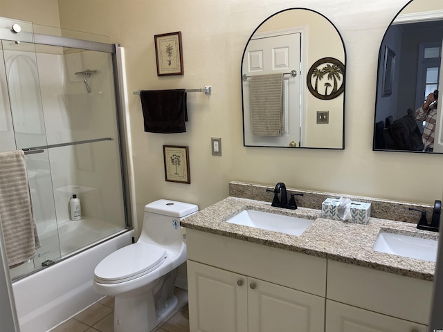9764 Leyland Dr Unit 7, Myrtle Beach, SC 29572 - full bath featuring double vanity, combined bath / shower with glass door, toilet, and tile patterned flooring