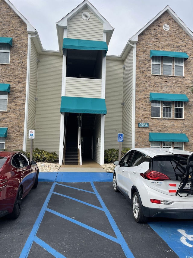 9764 Leyland Dr Unit 7, Myrtle Beach, SC 29572 - view of property featuring uncovered parking