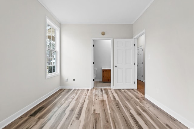 112 Staton Ln, Longs, SC 29568 - unfurnished bedroom with ornamental molding, light wood finished floors, and ensuite bath