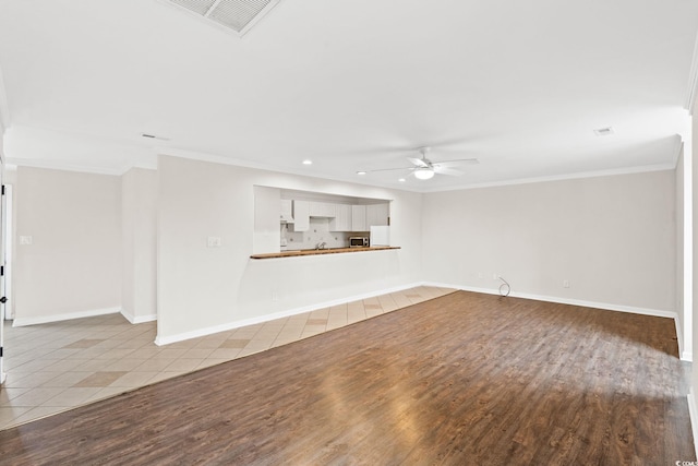 112 Staton Ln, Longs, SC 29568 - unfurnished living room featuring recessed lighting, a ceiling fan, crown molding, and wood finished floors