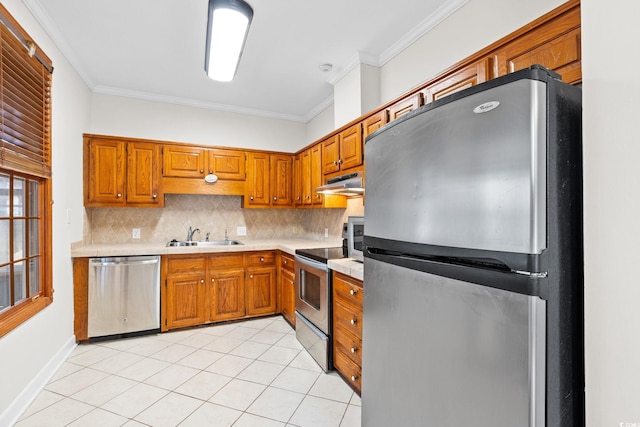 112 Staton Ln, Longs, SC 29568 - kitchen with stainless steel appliances, under cabinet range hood, tasteful backsplash, light tile patterned flooring, and light countertops