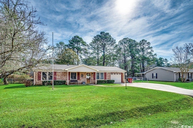 ranch-style house with a garage and a front yard