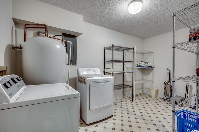 laundry area featuring separate washer and dryer and a textured ceiling