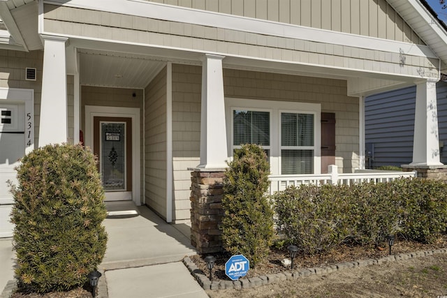 doorway to property featuring a porch