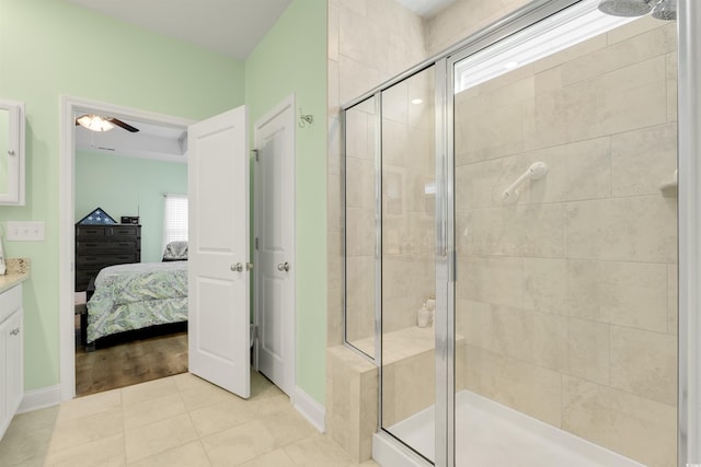 bathroom featuring vanity, tile patterned floors, and a shower with shower door