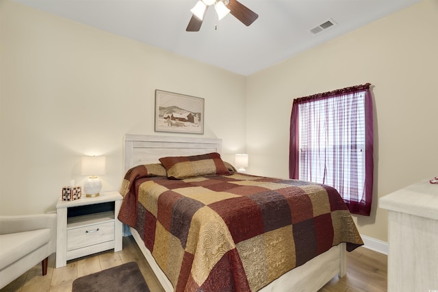 bedroom featuring ceiling fan and light hardwood / wood-style flooring