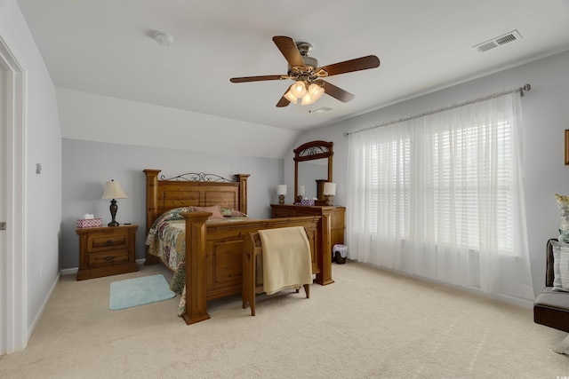 carpeted bedroom featuring ceiling fan and lofted ceiling