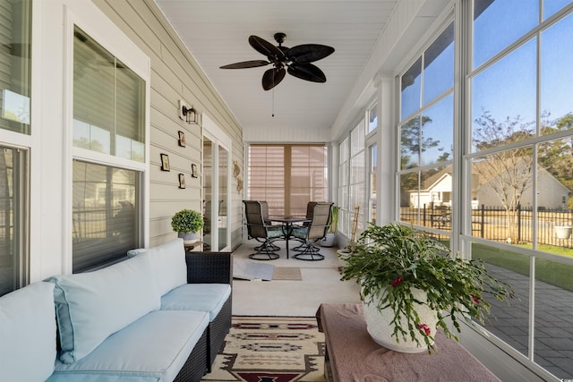 sunroom featuring a wealth of natural light and ceiling fan