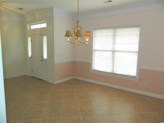 tiled entryway with ornamental molding and a notable chandelier