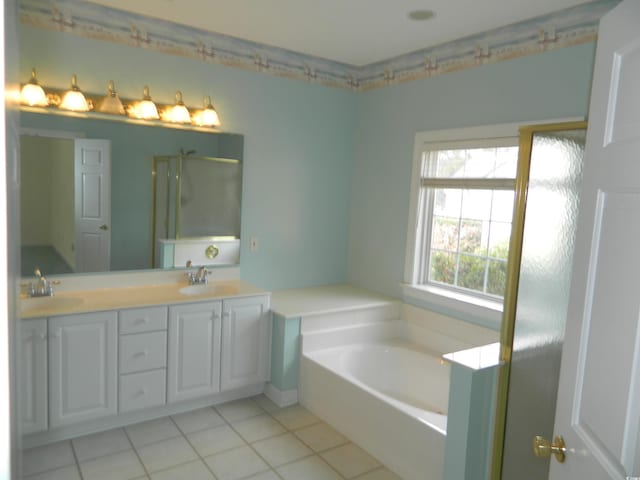 bathroom with vanity, tile patterned flooring, and separate shower and tub