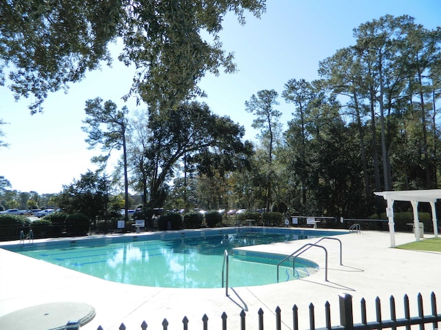 view of swimming pool featuring a patio area