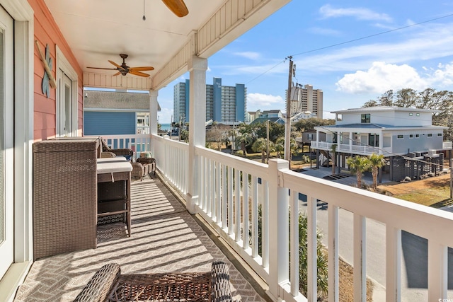 balcony featuring a ceiling fan