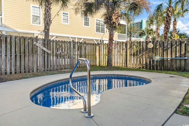 view of swimming pool featuring a fenced backyard