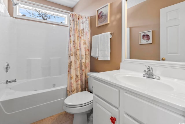 full bath featuring toilet, tile patterned flooring, shower / bath combo with shower curtain, and vanity