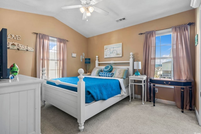 bedroom featuring baseboards, visible vents, ceiling fan, vaulted ceiling, and carpet flooring