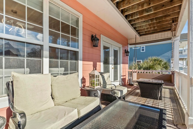 balcony featuring an outdoor hangout area and french doors