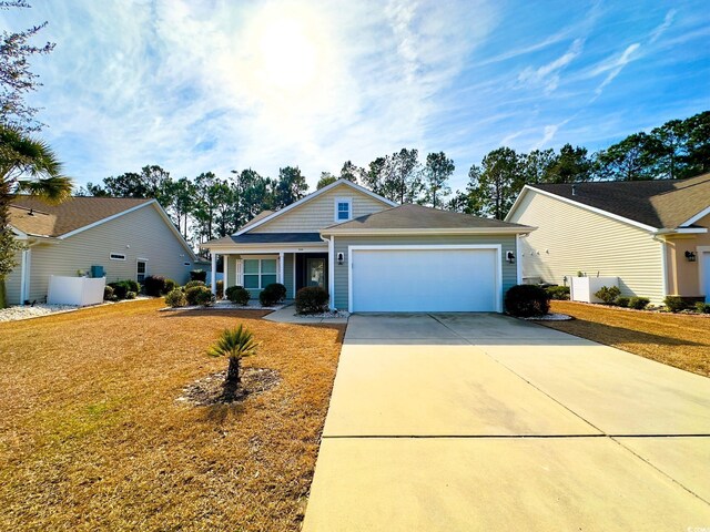 view of front facade featuring a garage and a front lawn