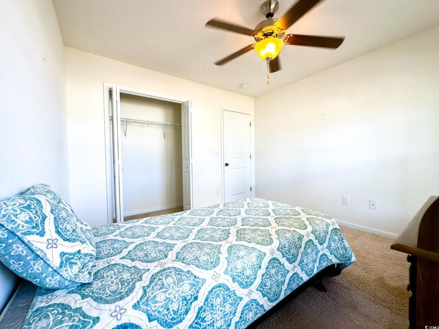 bedroom with carpet, ceiling fan, and a closet