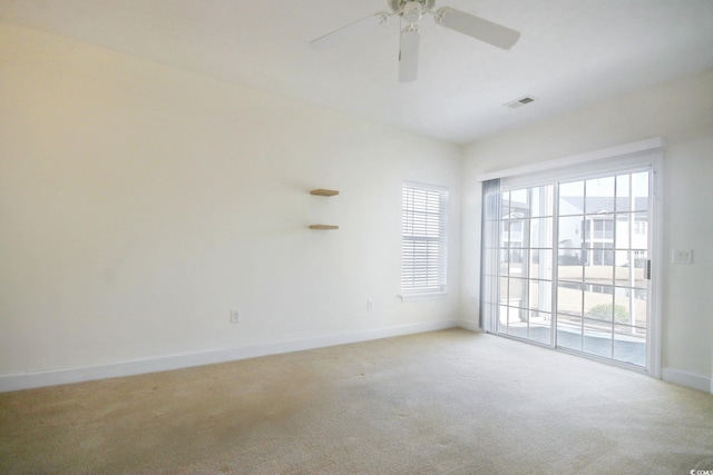 carpeted empty room with ceiling fan