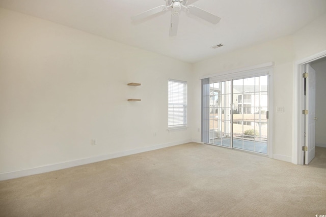 unfurnished room with light carpet and ceiling fan