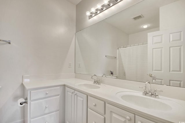 bathroom featuring vanity and walk in shower