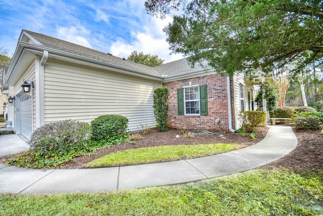 view of property exterior with a garage