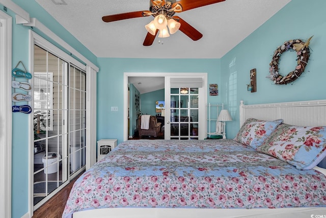 bedroom with ceiling fan, dark wood-type flooring, a textured ceiling, and access to outside