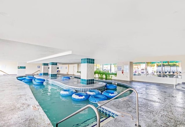 view of pool featuring a patio