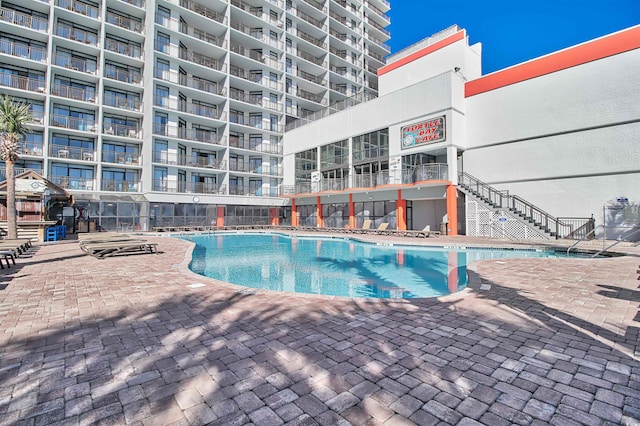 pool with a patio