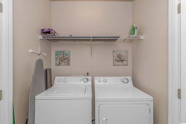 laundry area featuring laundry area and washing machine and clothes dryer