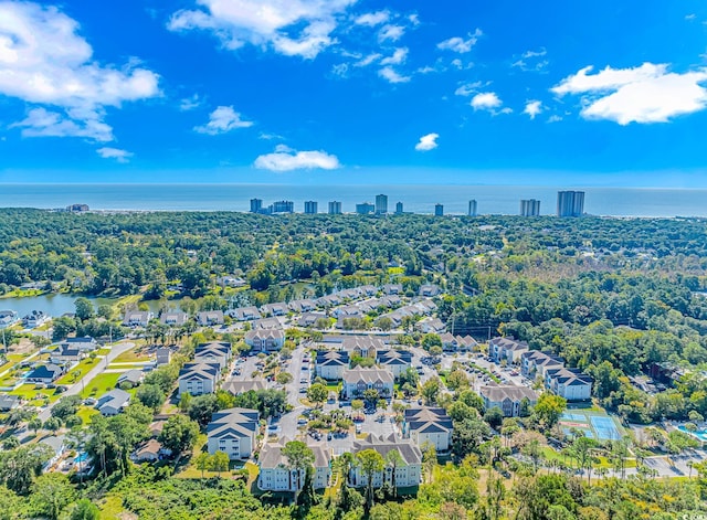 drone / aerial view with a water view and a residential view