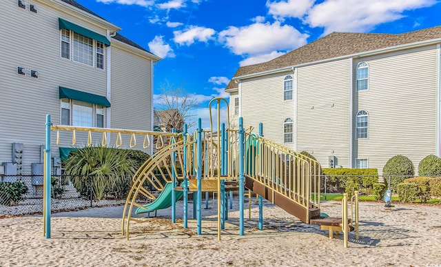 view of playground featuring fence