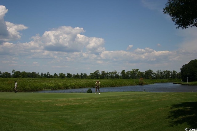 81 Delray Dr Unit 2-C, Murrells Inlet, SC 29576 - view of community with a water view, a lawn, and view of golf course