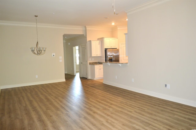 81 Delray Dr Unit 2-C, Murrells Inlet, SC 29576 - unfurnished living room with a chandelier, crown molding, light wood-style flooring, baseboards, and recessed lighting