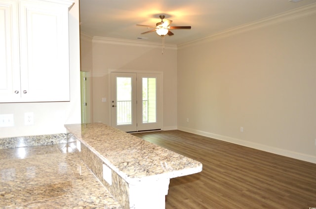 81 Delray Dr Unit 2-C, Murrells Inlet, SC 29576 - kitchen featuring a ceiling fan, crown molding, dark wood-style flooring, white cabinets, and a peninsula