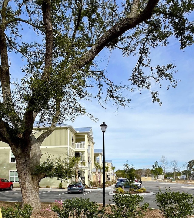 81 Delray Dr Unit 2-C, Murrells Inlet, SC 29576 - view of asphalt road with street lights, sidewalks, and curbs