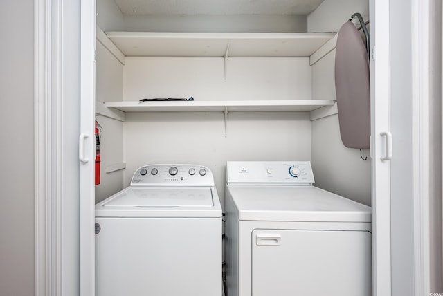 laundry room featuring separate washer and dryer