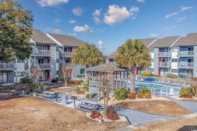 view of property's community featuring a gazebo and a pool