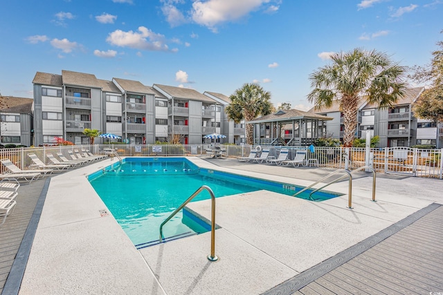 view of swimming pool featuring a gazebo and a patio