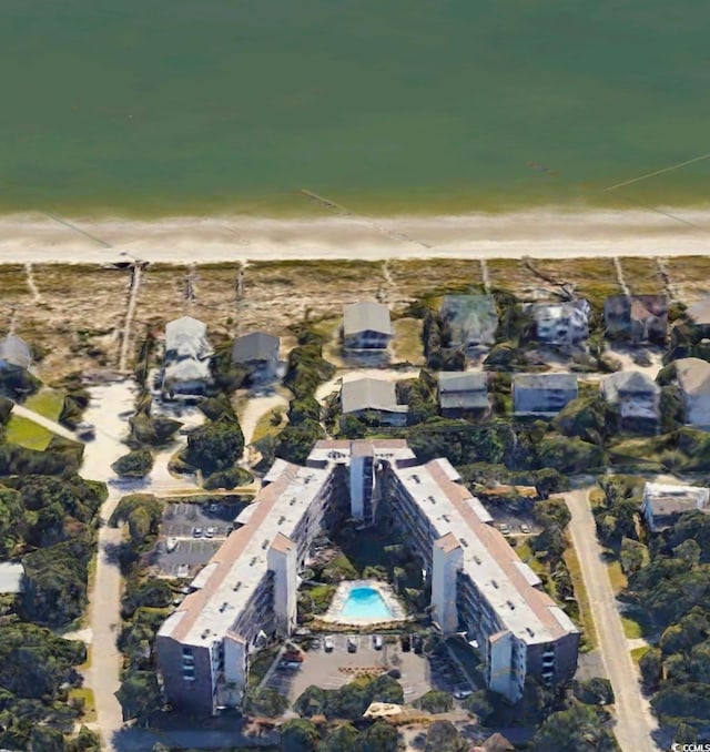 birds eye view of property featuring a view of the beach and a water view