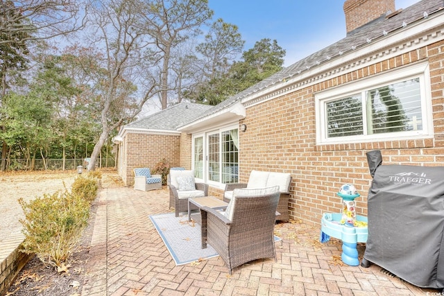 view of patio / terrace featuring a grill and an outdoor living space